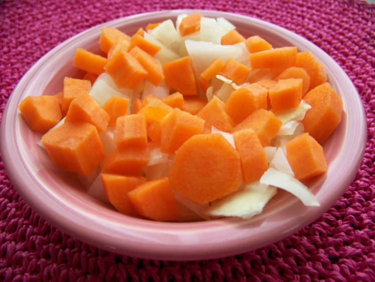 Chop up the onion and carrot. 