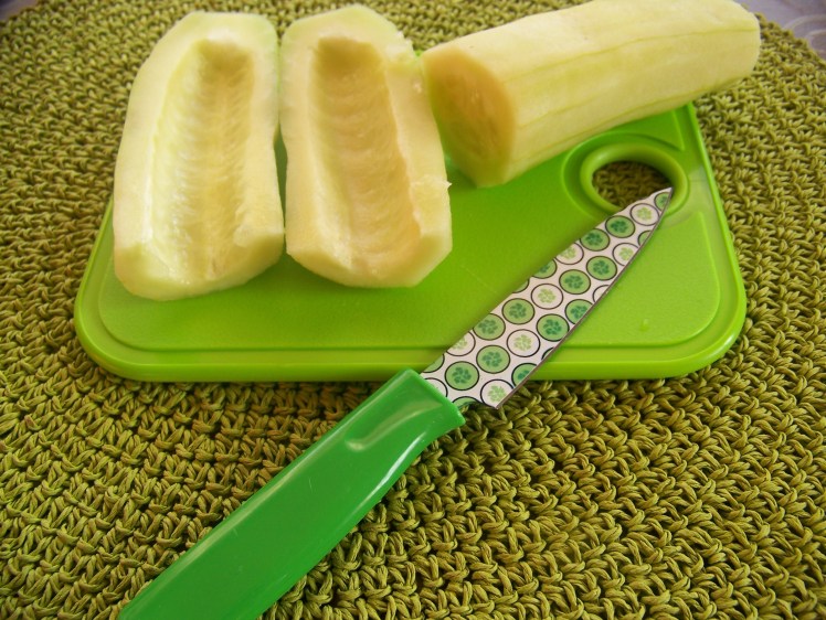 Slice the cucumber in half and scoop out the seeds with a spoon. 