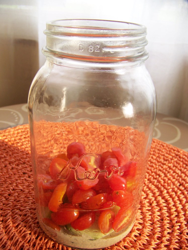 I find that cherry or grape tomatoes hold their shape better and do not get as runny in the jars as larger tomatoes.