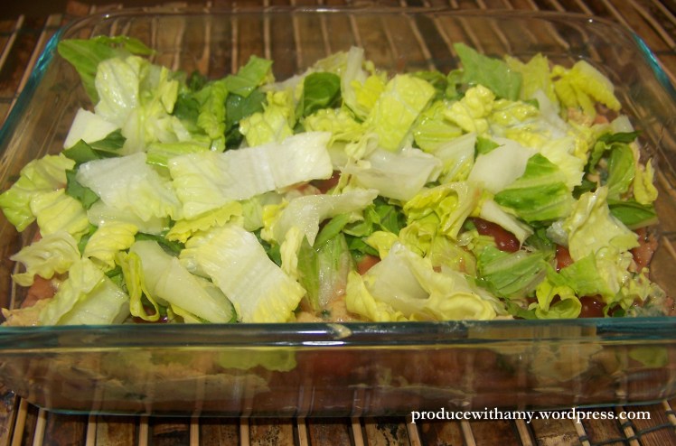 A layer of crispy lettuce gives the dip a pleasing crunch.