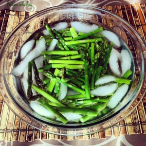 Blanching involves a quick immersion in boiling water and placing the vegetable instantly in an ice bath. This process allows the asparagus to turn vibrant green and remain crisp.