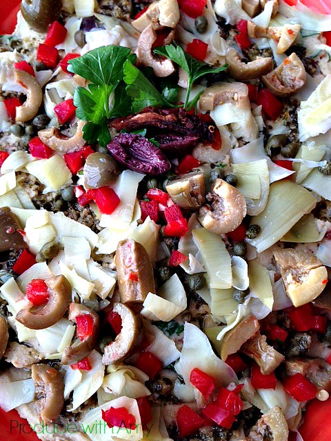 Hummus dip with olives and capers