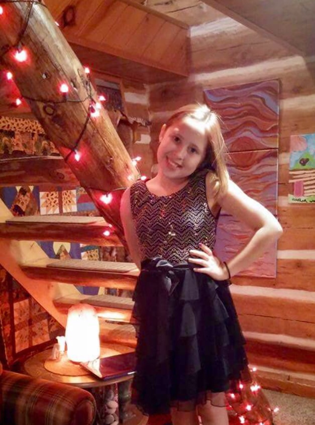 Avalon posing in her Homecoming dress. What a beauty!