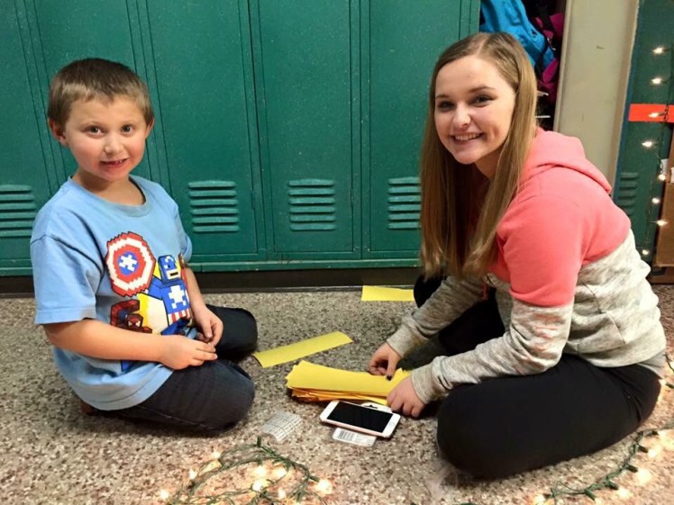 Lukas and Lorraine work on creating the yellow brick road in the hallway. 