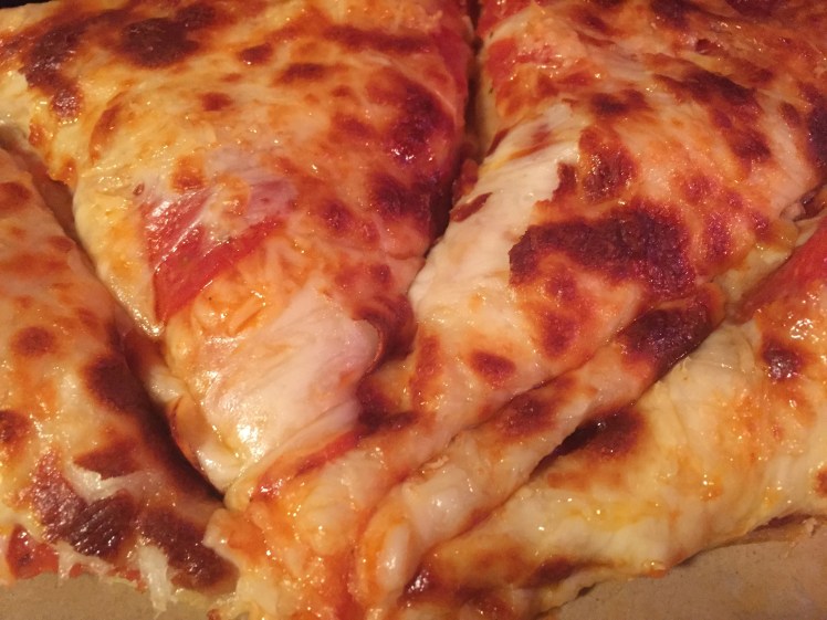 Pizza for the kids with extra cheese.