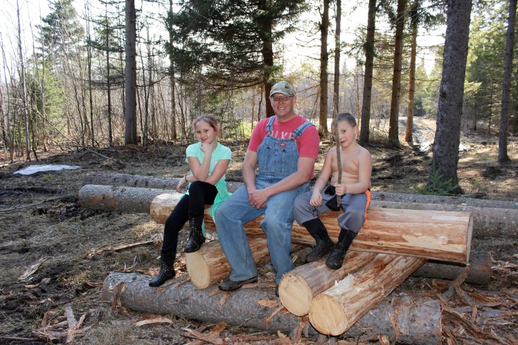 John started cutting and peeling logs for our home addition and covered deck.